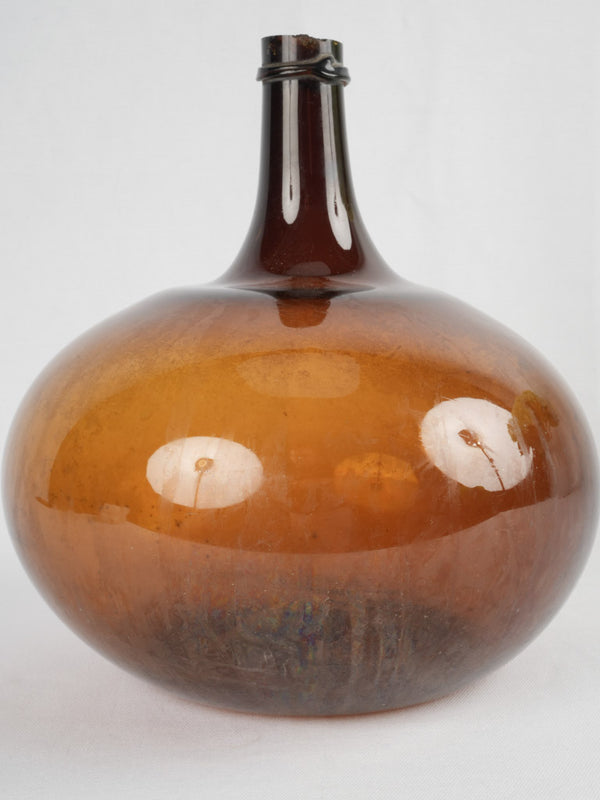 Antique amber-colored French demijohn vase