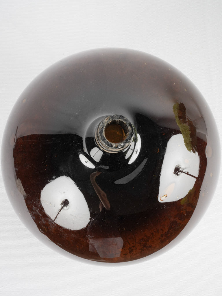 Aged blown glass wine bottle