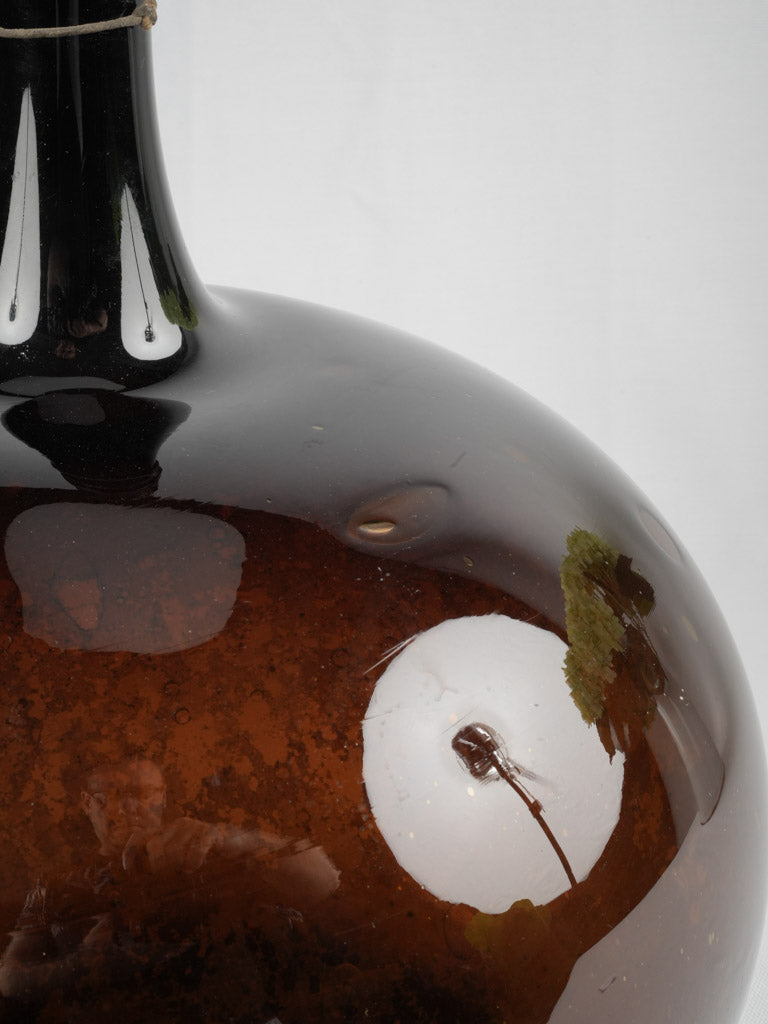 Rustic amber-colored demijohn decor piece