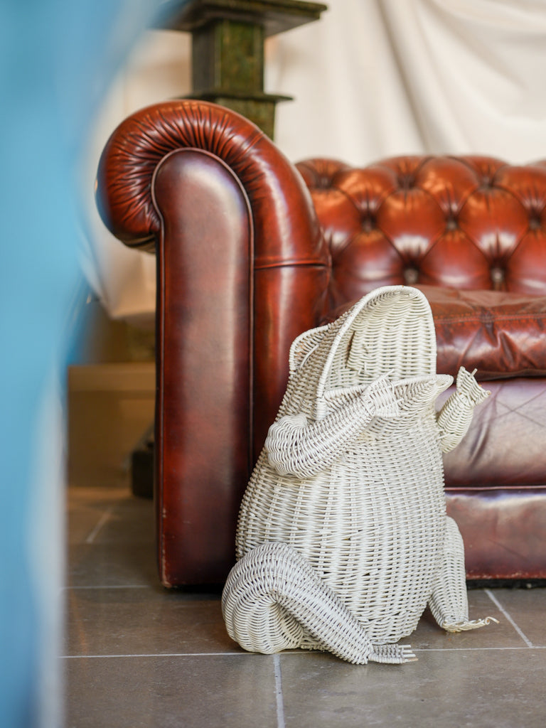 Playful white wicker wastebasket  