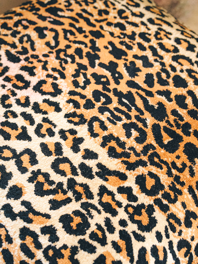 Distinctive leopard motif poufs