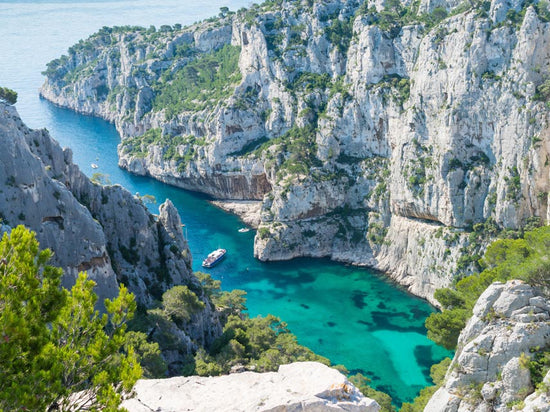 Explore the dramatic coastline of the Calanques by boat
