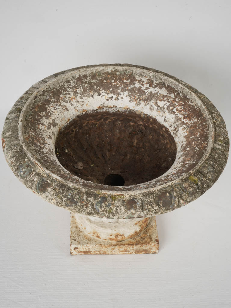 Weathered cast-iron pedestal urn  