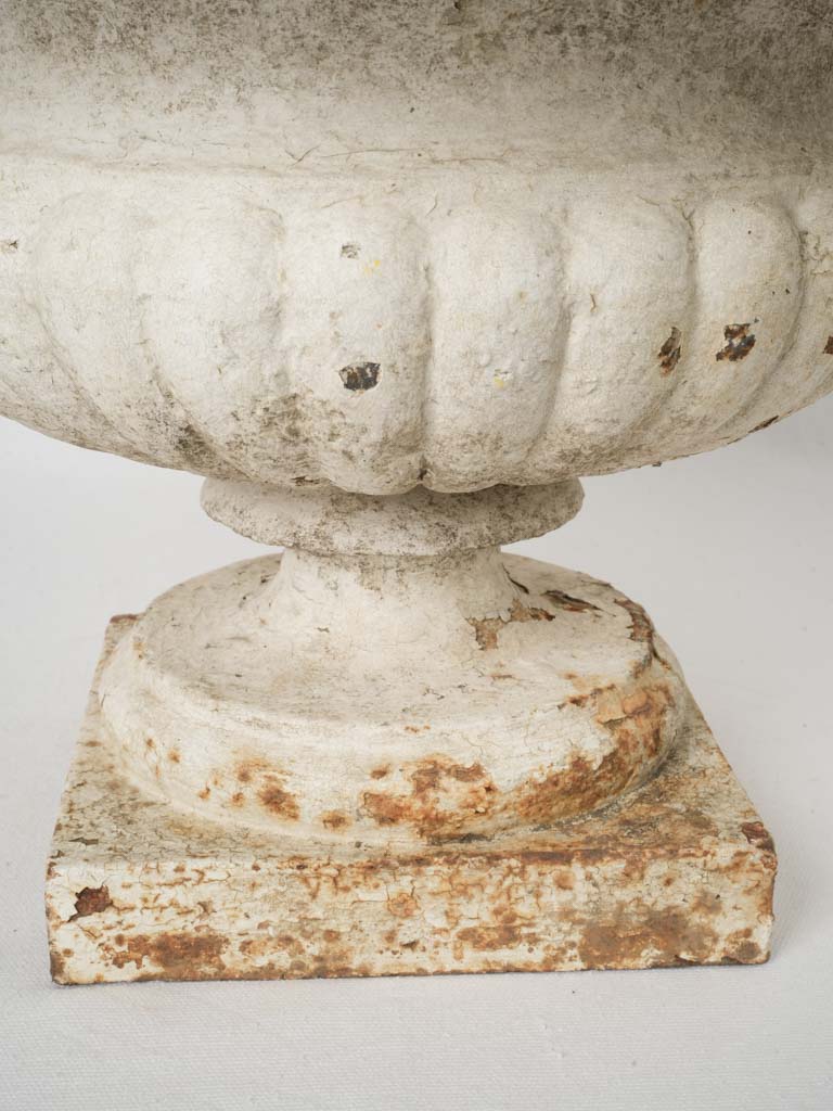 Timeless moss-encrusted cast-iron planter  