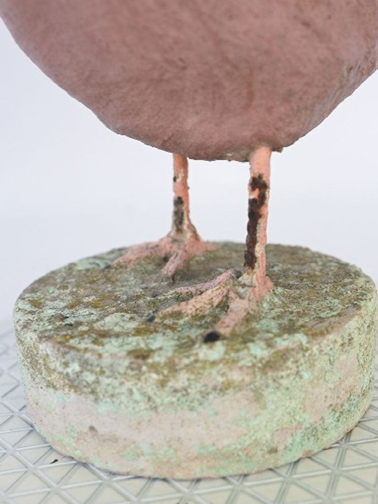 Weathered moss-patina concrete hen  