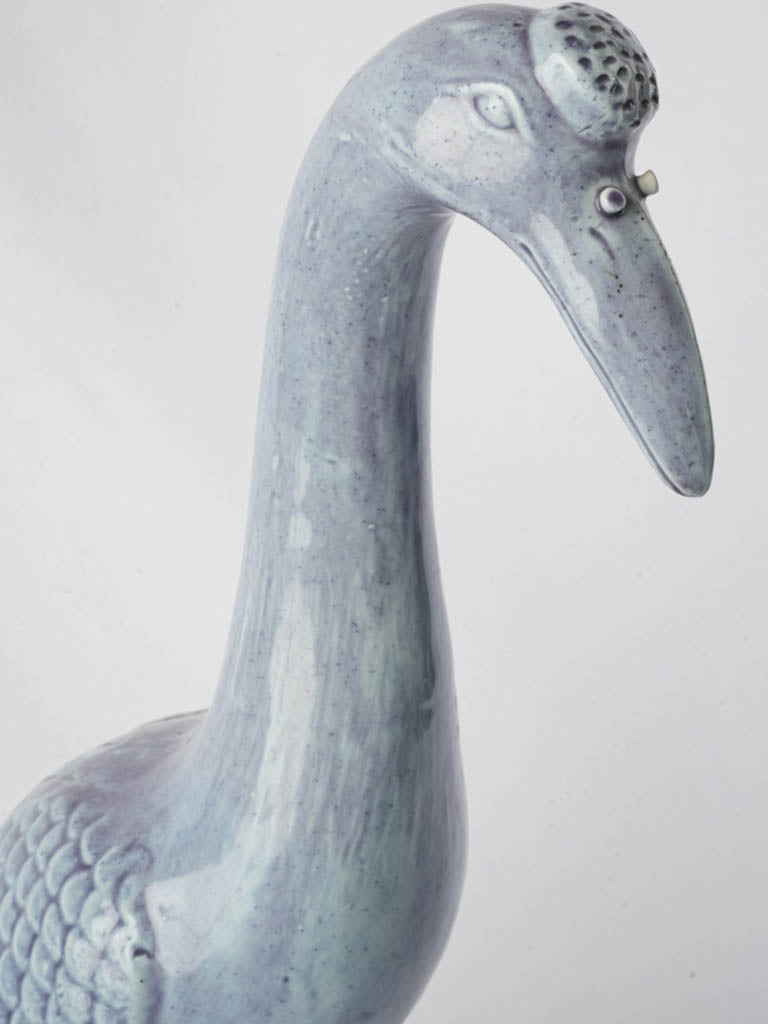 Nuanced periwinkle glazed crane statue  