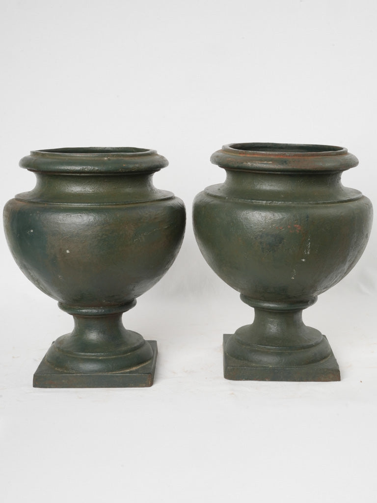 Refined vintage cast iron urns