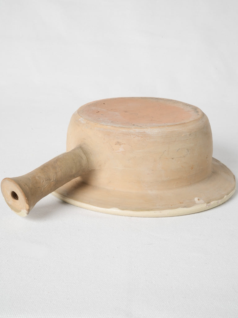 Time-worn Provencal terracotta container