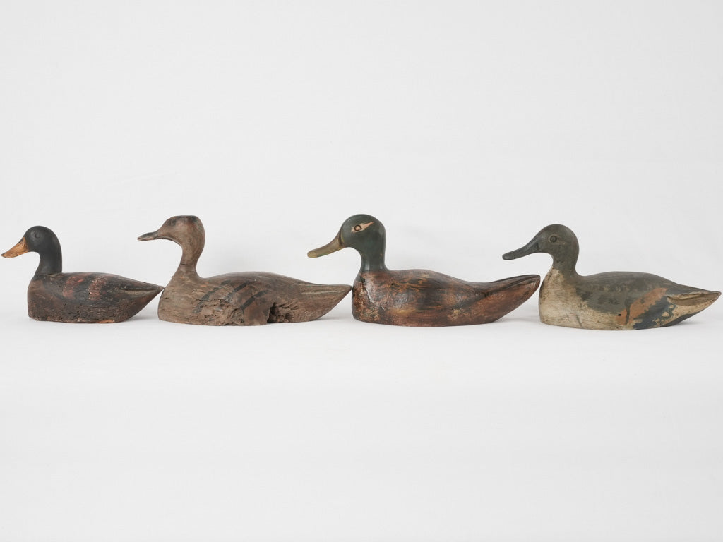 Rustic handcrafted decoy duck quartet
