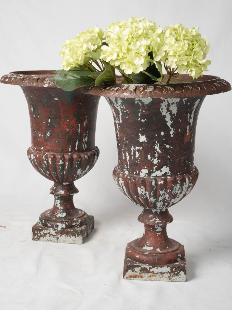 Distressed red vintage urns  