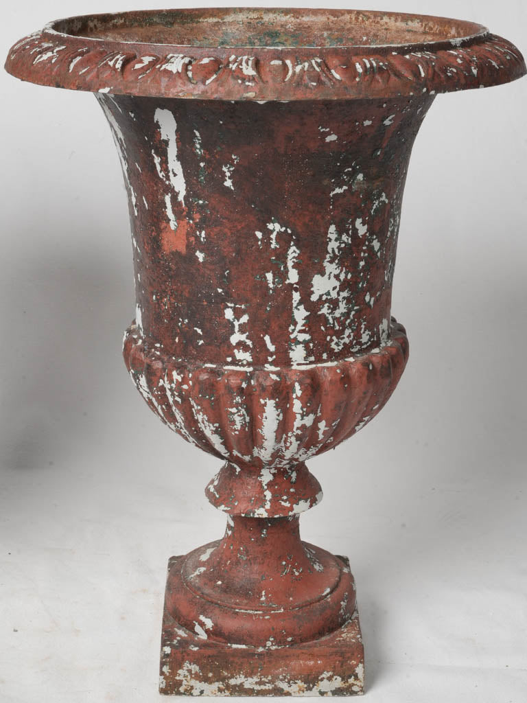 Picturesque antique cast-iron urns  