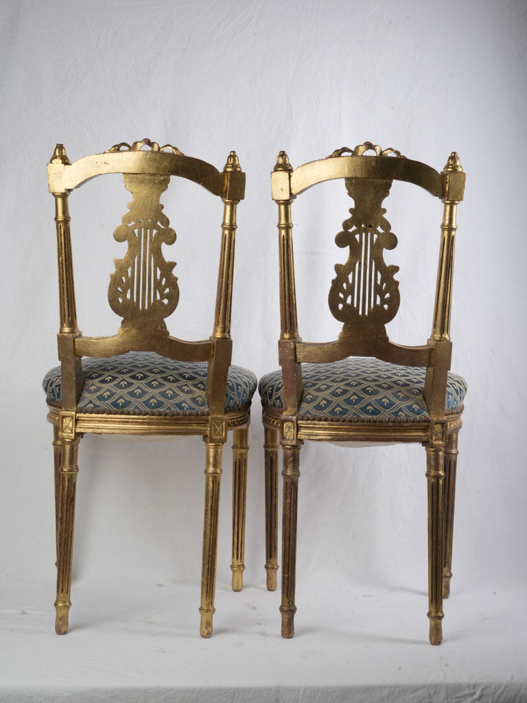 Dramatic carved lyre-back chairs