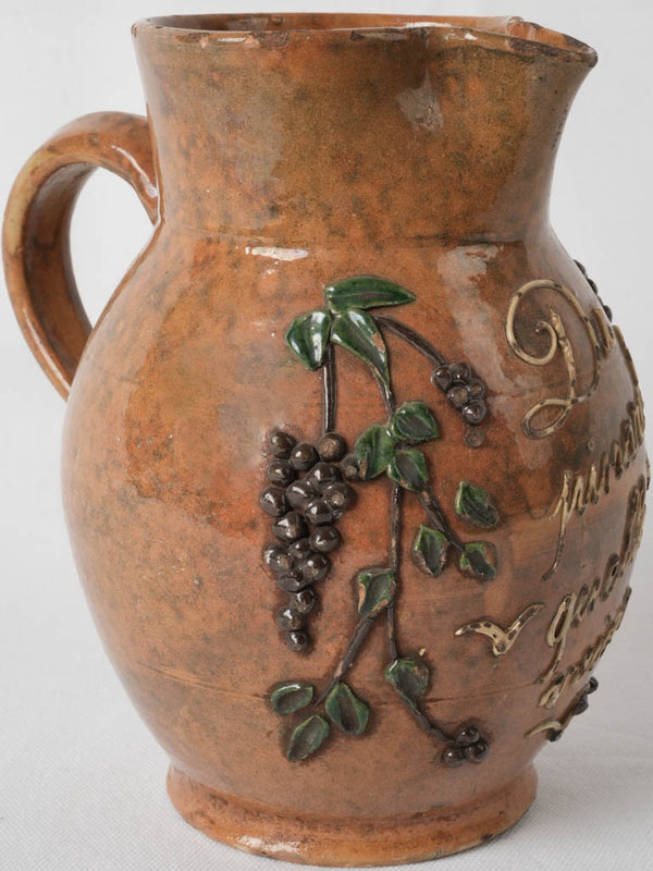 Antique French ceramic pitcher with engravings