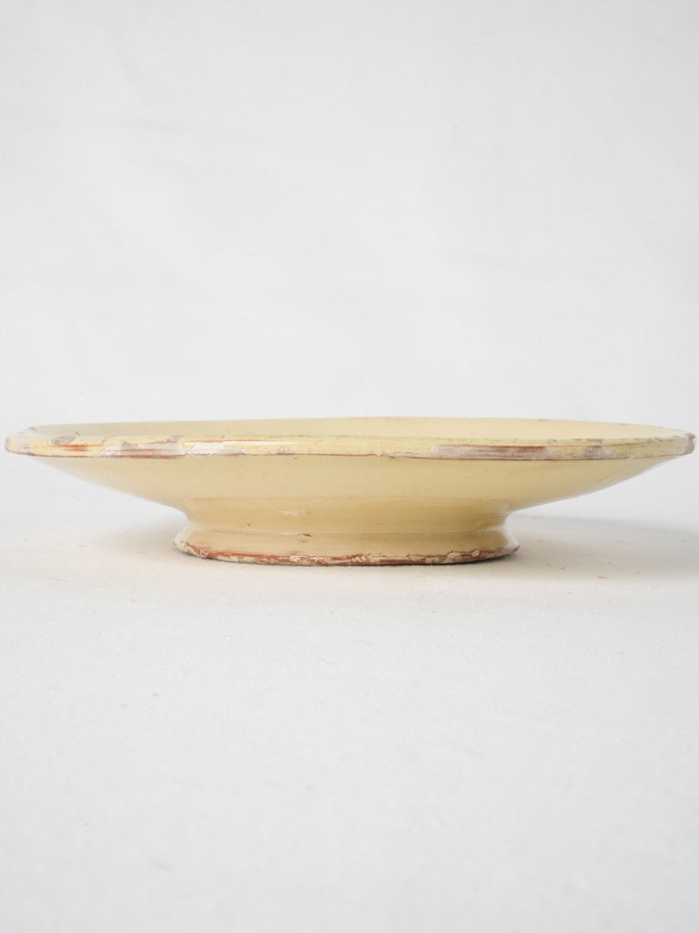 Rustic, yellow-glazed French antique plate