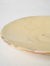 Pale yellow, footed French pottery plate