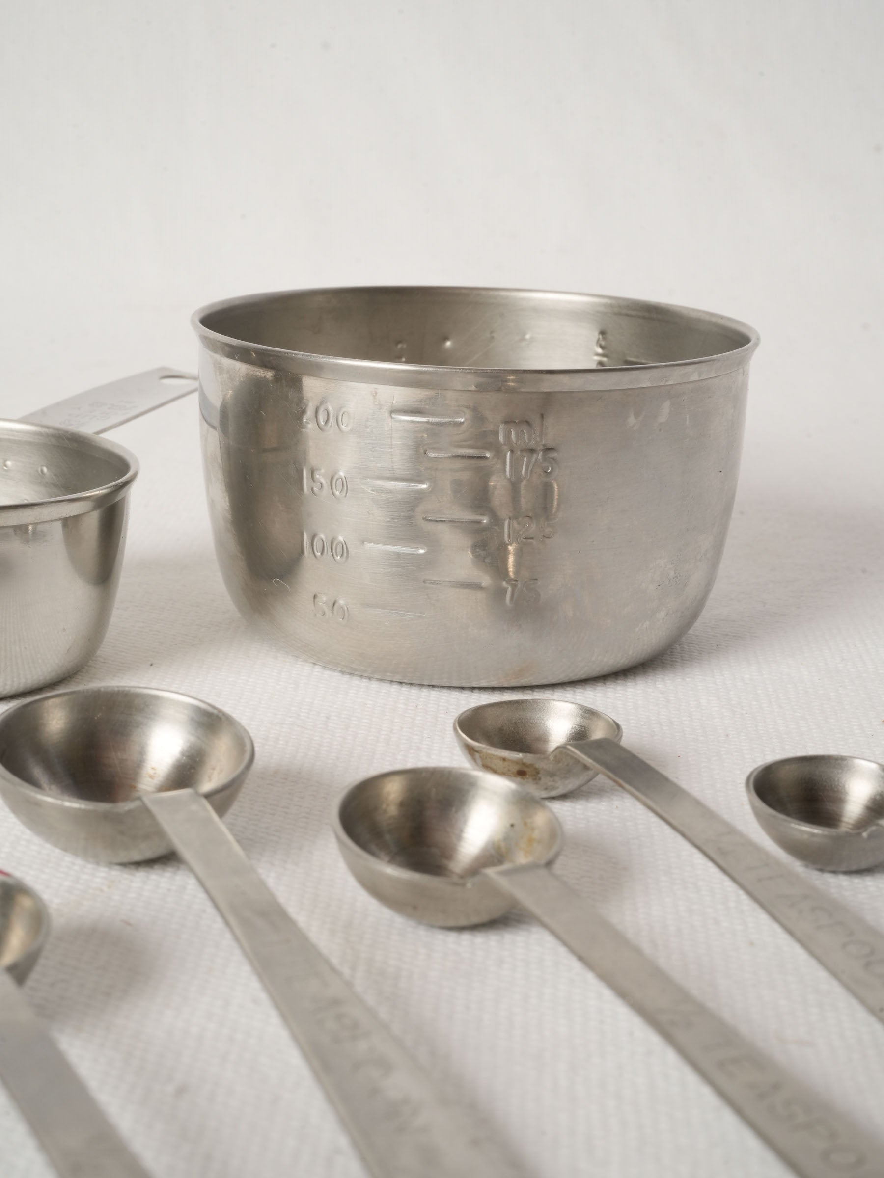 Vintage French Stainless Steel Measuring Cups with Peg Rails