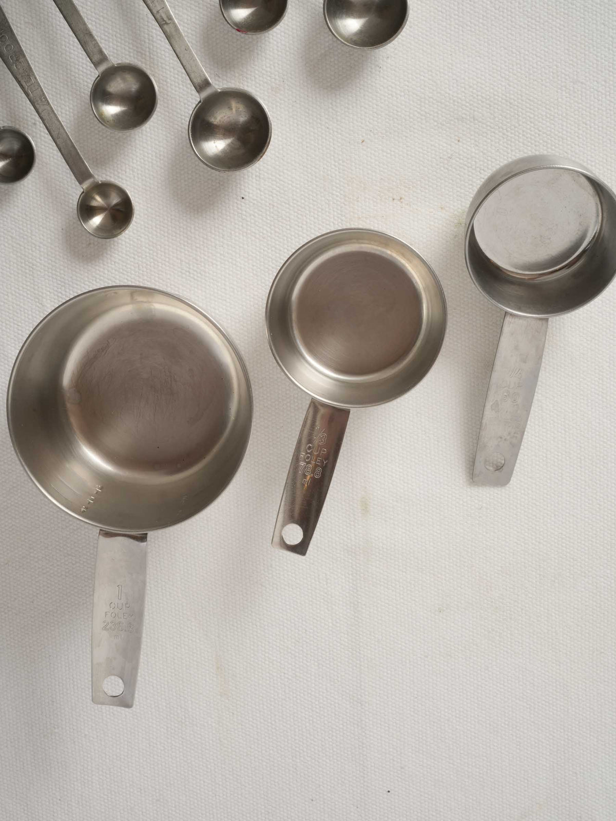 Vintage French Stainless Steel Measuring Cups with Peg Rails