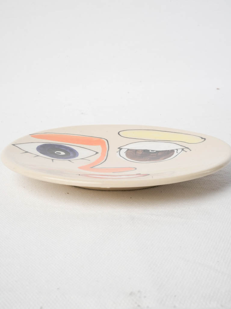 Asymmetrical stylized-face wall art