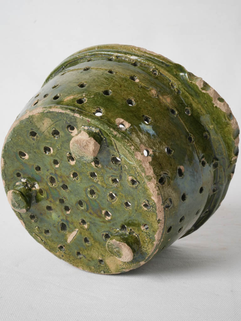 Ribbed handled, perforated, antique green-glazed pot