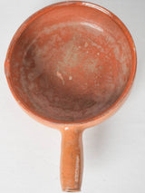 Elegant terracotta-handled cooking pot