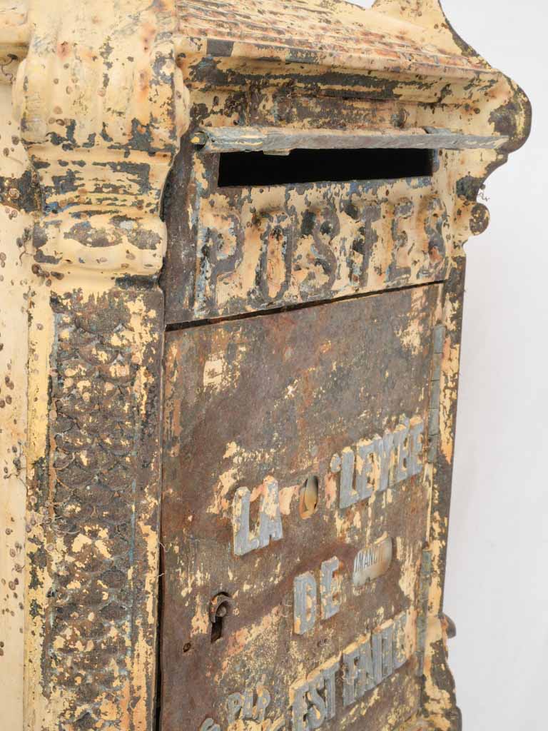 Charming yellow antique post box