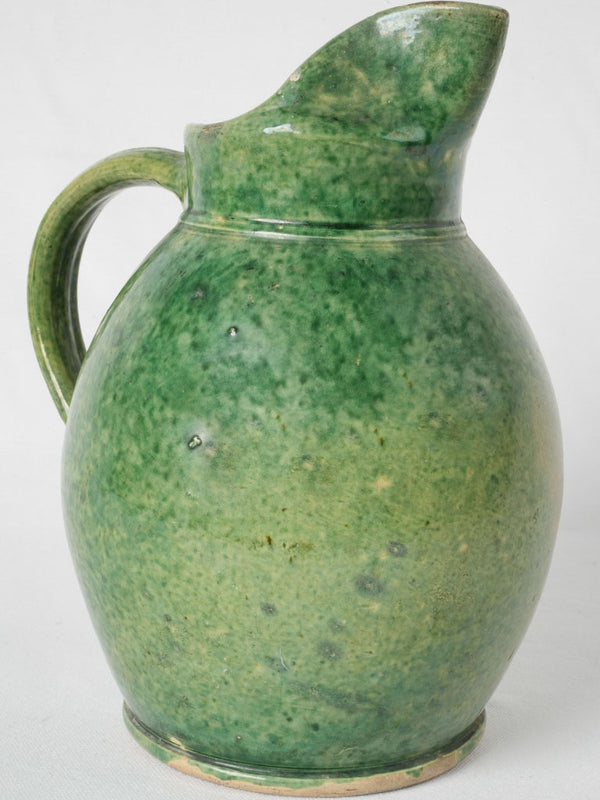 Antique French terracotta pitcher with green glaze