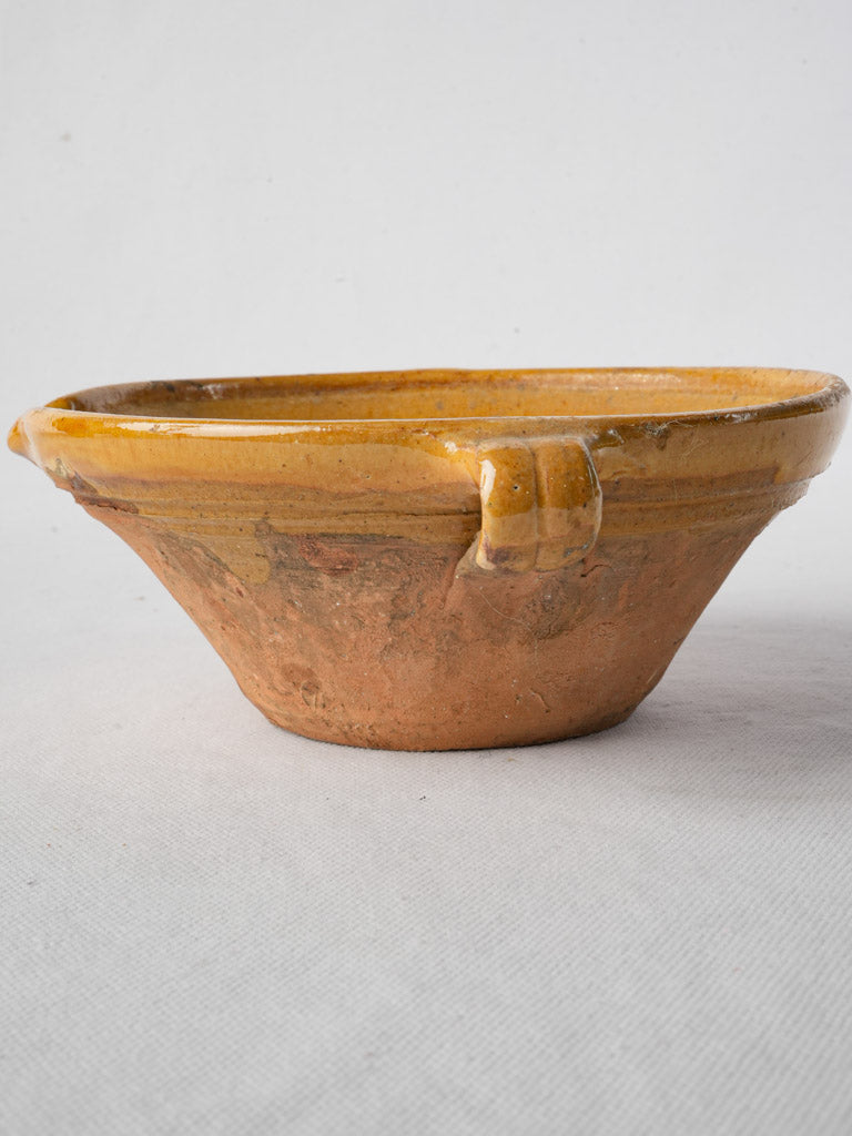 Mustard-yellow glazed ceramic bowl  