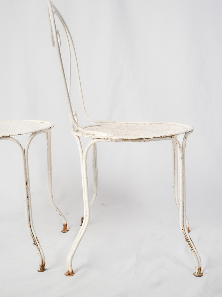 Charming decorative scroll-back seats  