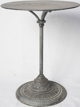 Antique scroll-based French bistro table