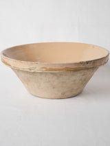 Aged cream-glazed terracotta fruit bowl