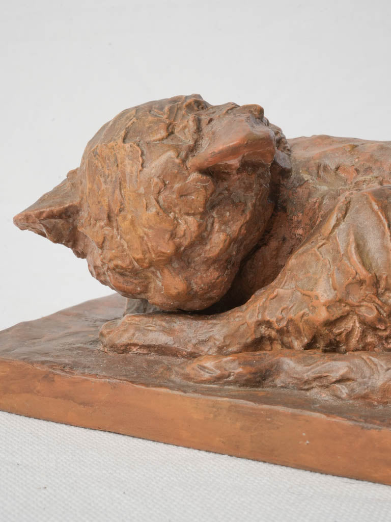 Distinctively styled terracotta cat figure  