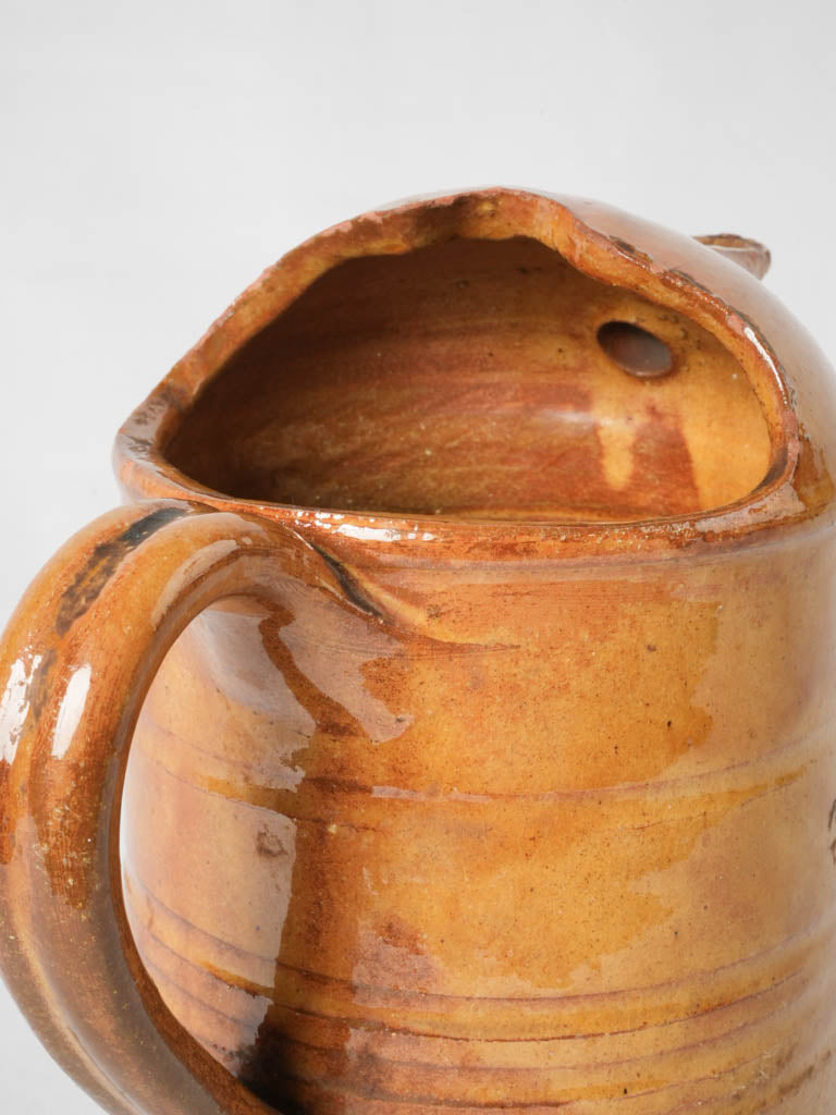 Provencal-style yellow glazed water pitcher