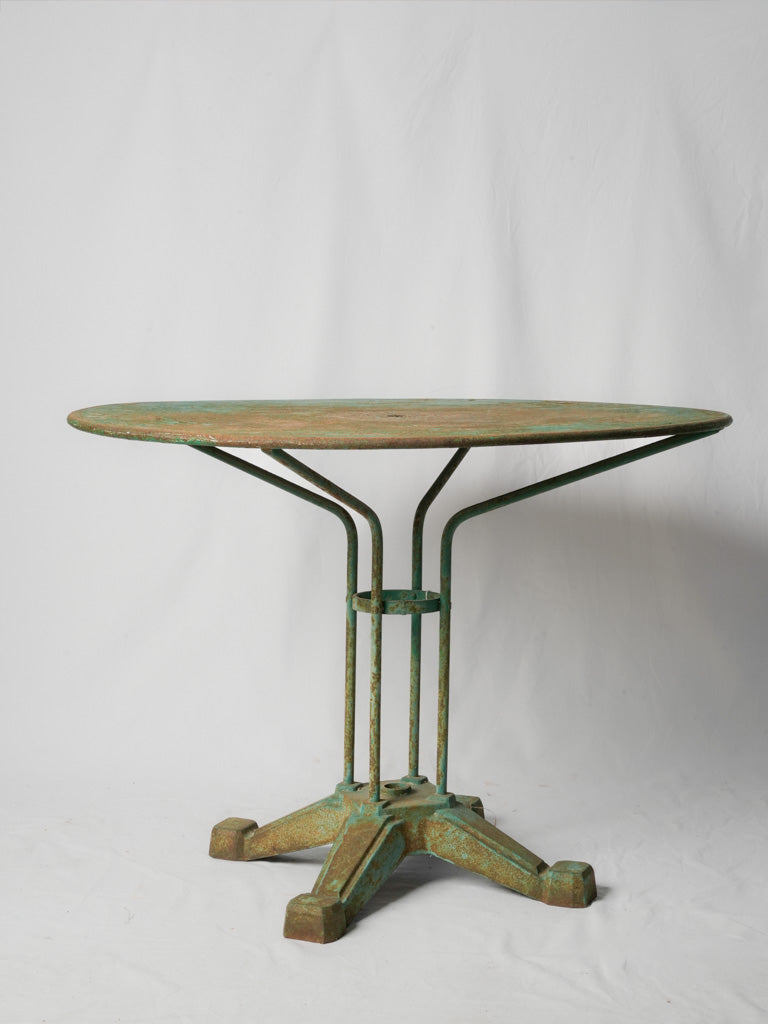 Aged turquoise-green wrought iron table  