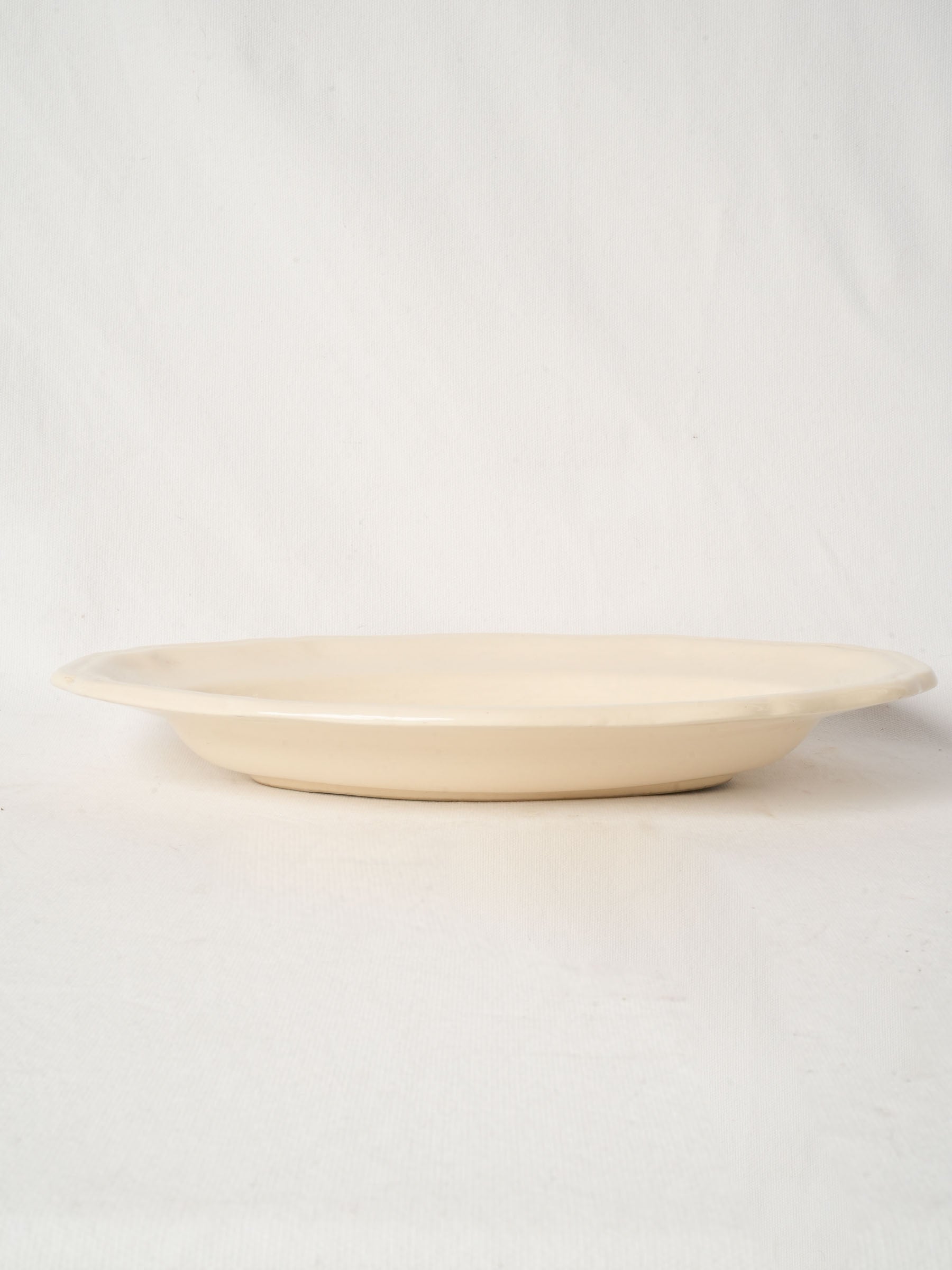 Antique french ivory-glazed ceramic serving dish