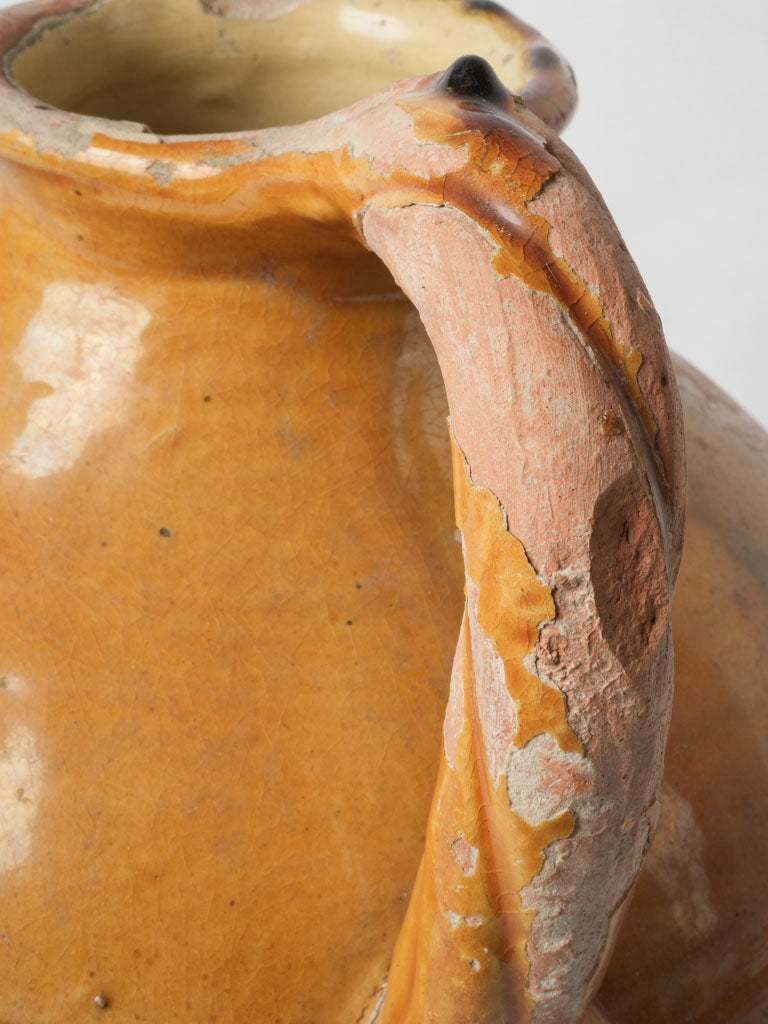 Worn glazed water pitcher from France