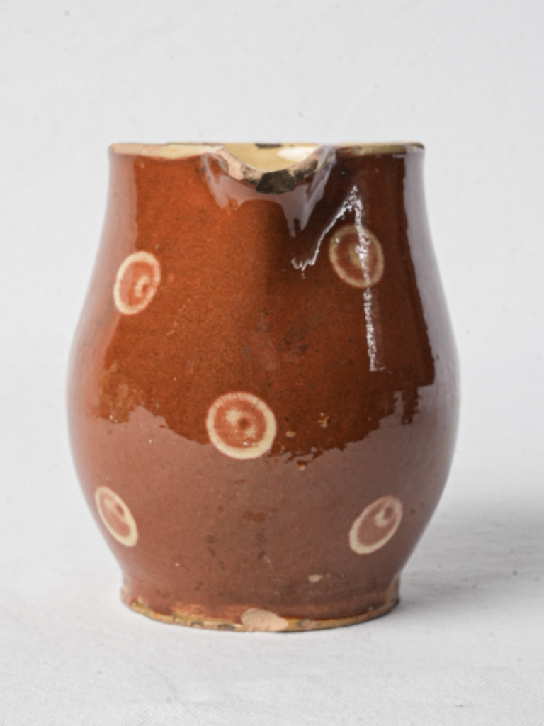 Cinnamon-colored ceramic pitcher, glazed finish