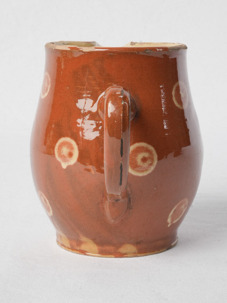 Aged traditional creamer with wear