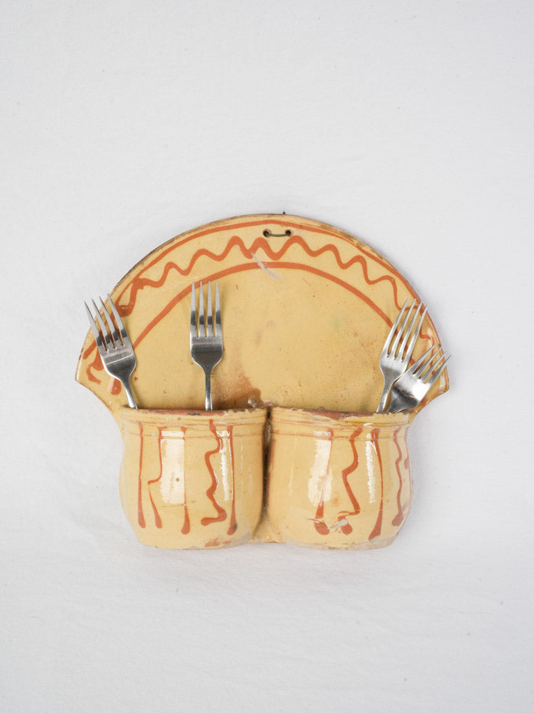 Earthenware glazed wall-mounted holder.  