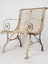 Antique white wrought-iron garden chair