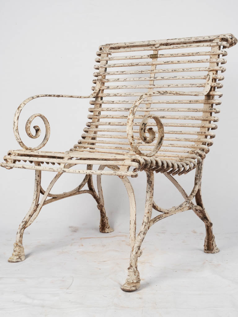 Antique white wrought-iron garden chair
