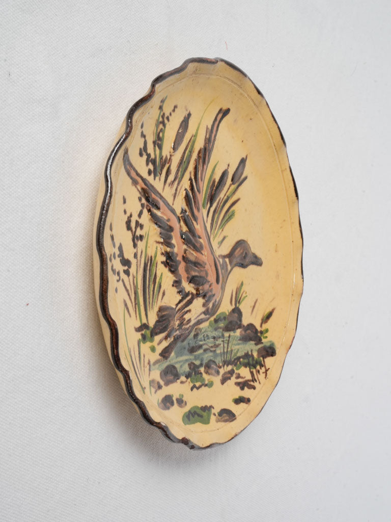 Earth-toned relief scene plate