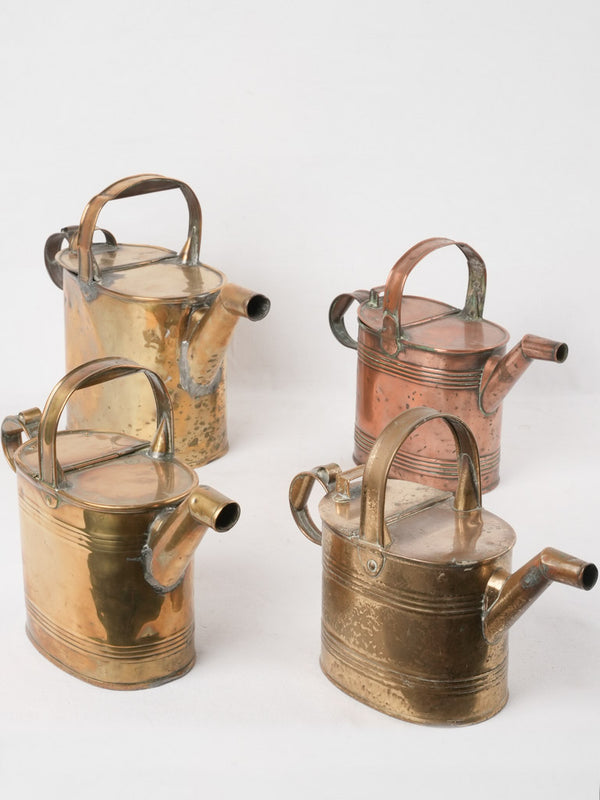 Collection of 4 copper watering cans