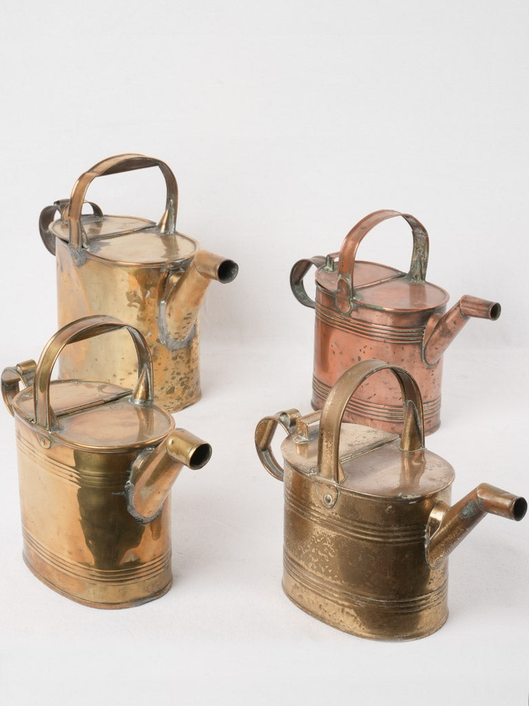 Collection of 4 copper watering cans