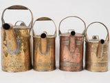 Collection of 4 copper watering cans