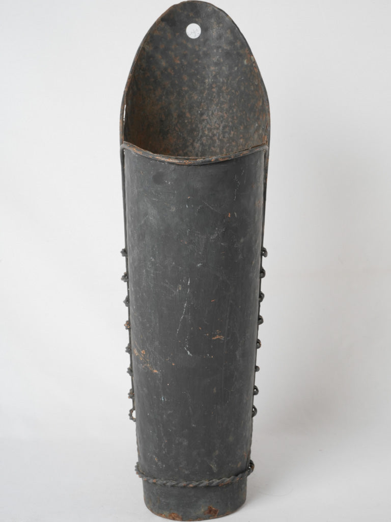 Playful black iron umbrella stand boot