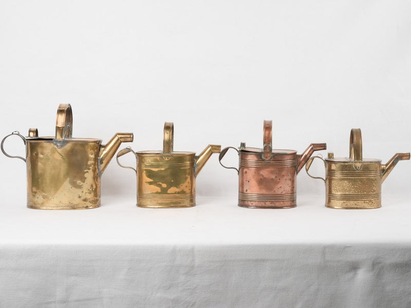 Collection of 4 copper watering cans