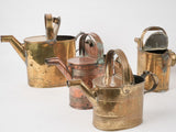 Collection of 4 copper watering cans
