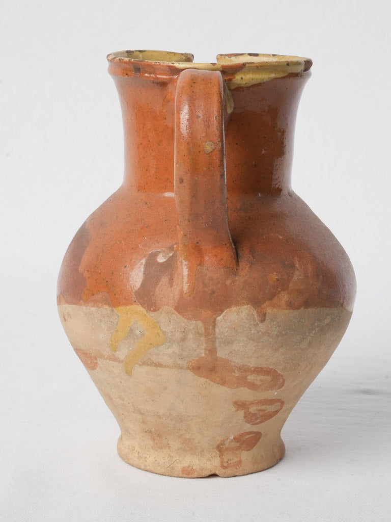 Aged russet-finished clay pitcher  