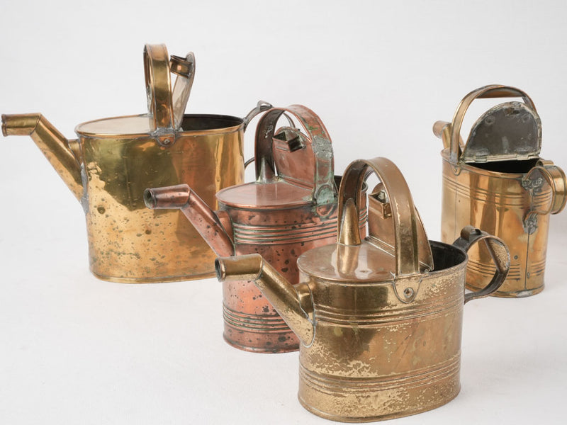 Collection of 4 copper watering cans