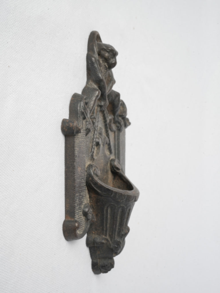 Graphite-toned rocaille scroll match holder